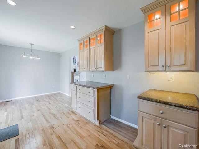 21728 Ruth Street Farmington, MI 48336 - Photo 19 of 54 Light wood-finish flooring extending into an open space
