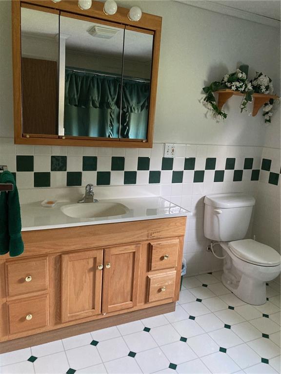 325 Owen Drive Johnstown, PA 15904 - Photo 8 of 15 a bathroom with a granite countertop sink mirror vanity and toilet