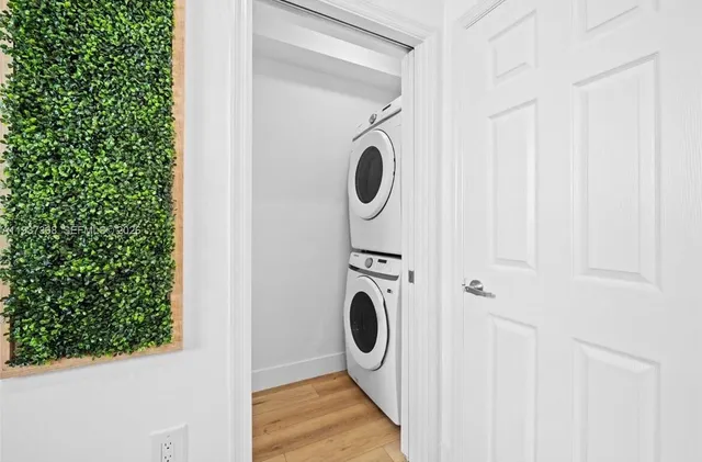 a close view of a utility room with dryer and washer