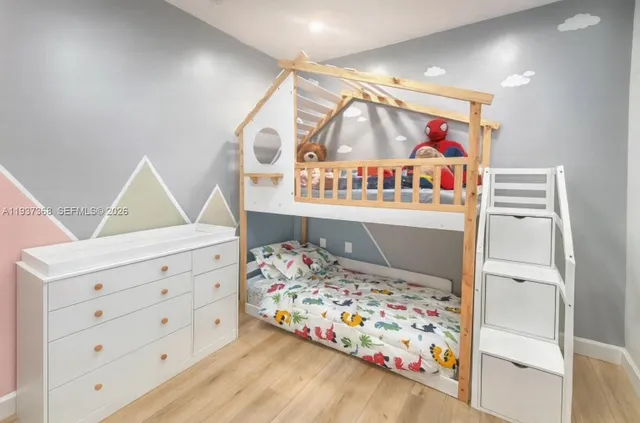 a bed room with a bed and a window