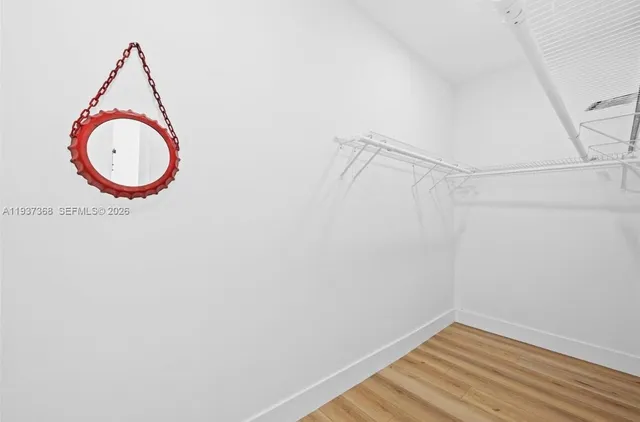 a view of a small space with wooden floor