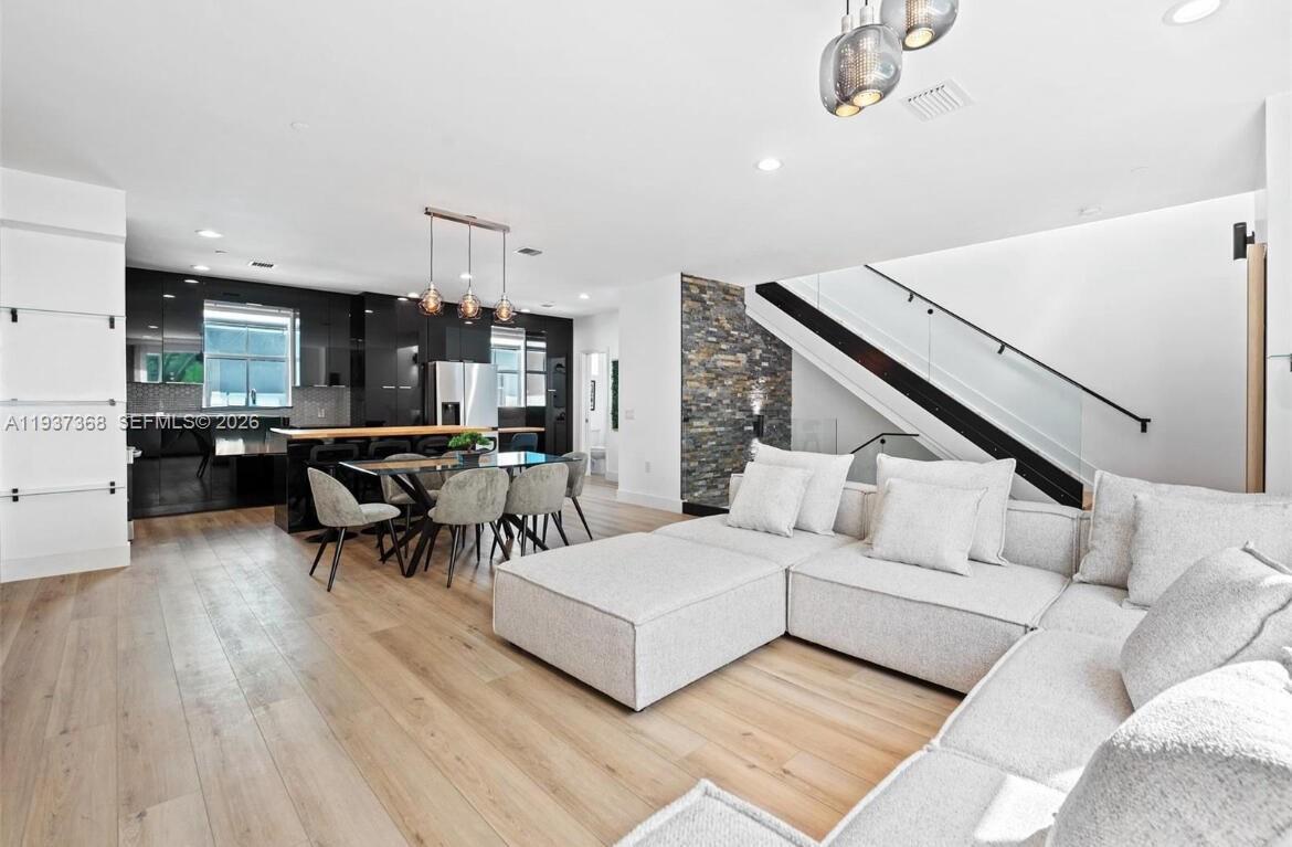 1705 Johnson Street, Unit B Hollywood, FL 33020 - Photo 5 of 34 a living room with furniture and a wooden floor