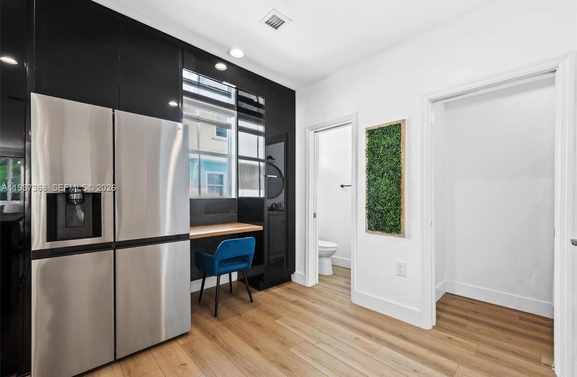 1705 Johnson Street, Unit B Hollywood, FL 33020 - Photo 9 of 34 a kitchen with stainless steel appliances granite countertop a refrigerator and a window