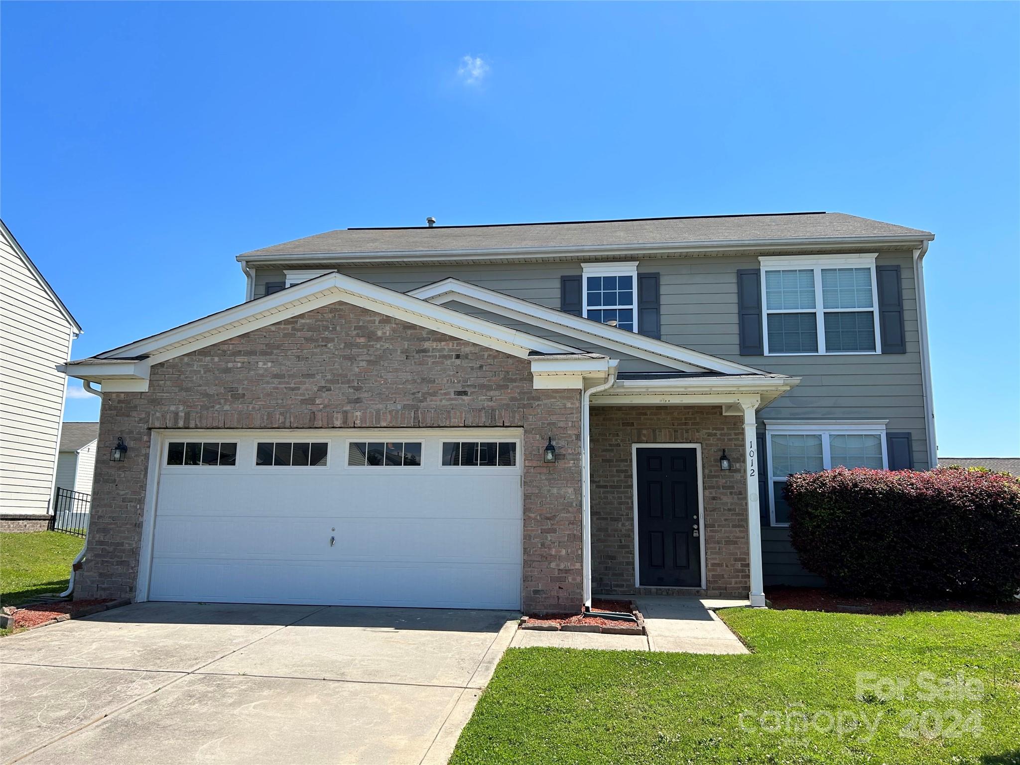 1012 Green Terra Road Indian Trail, NC 28079 - Photo 2 of 14 a front view of a house with a yard