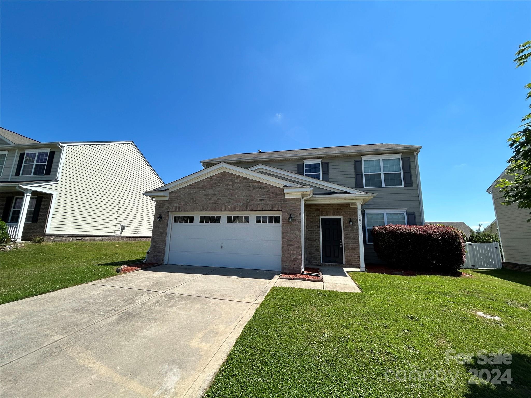 1012 Green Terra Road Indian Trail, NC 28079 - Photo 3 of 14 a front view of a house with a yard