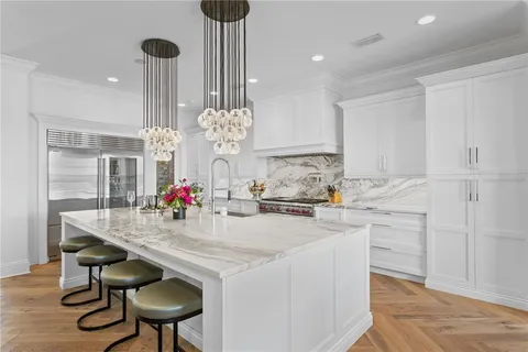 a spacious bedroom with a bed and a book shelf