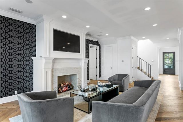 a view of a house with a swimming pool and porch