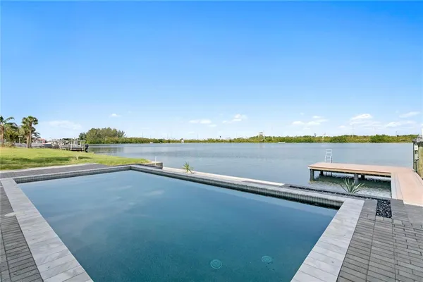 a view of a swimming pool with an ocean view