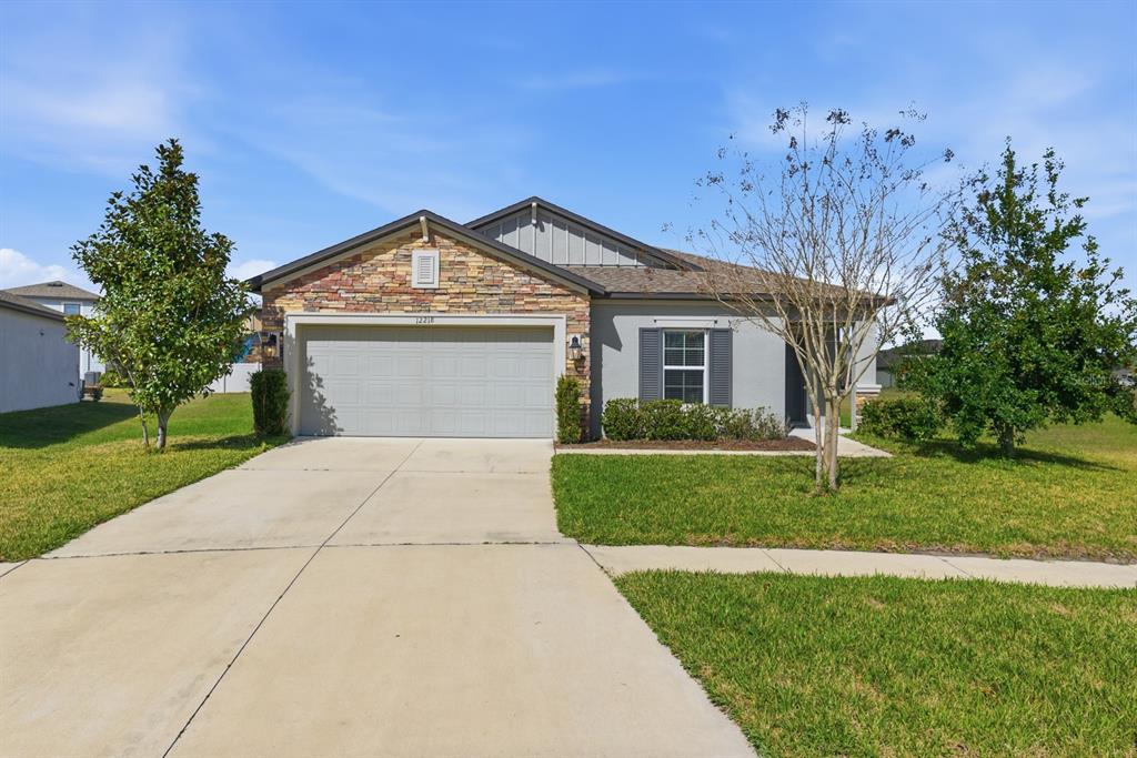 a front view of a house with a yard