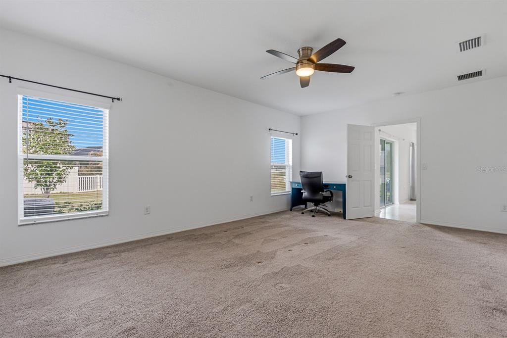 12218 Gothic Rd Spring Hill Spring Hill, FL 34610 - Photo 22 of 56 a view of a livingroom with a ceiling fan and window