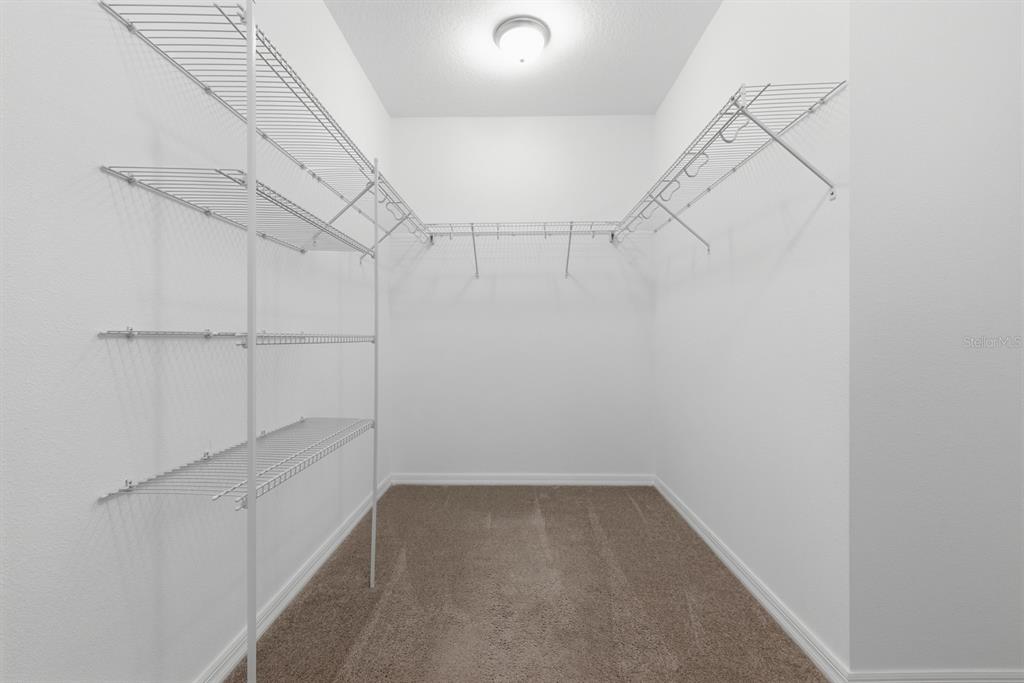 12218 Gothic Rd Spring Hill Spring Hill, FL 34610 - Photo 24 of 56 a view of a room with racks on the wall