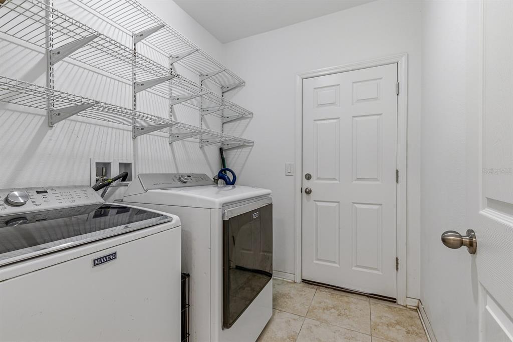 12218 Gothic Rd Spring Hill Spring Hill, FL 34610 - Photo 27 of 56 a utility room with dryer and washer
