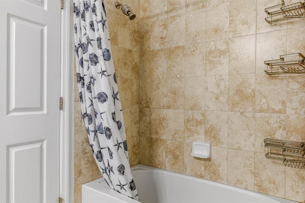 12218 Gothic Rd Spring Hill Spring Hill, FL 34610 - Photo 30 of 56 a bathroom with a bathtub and shower