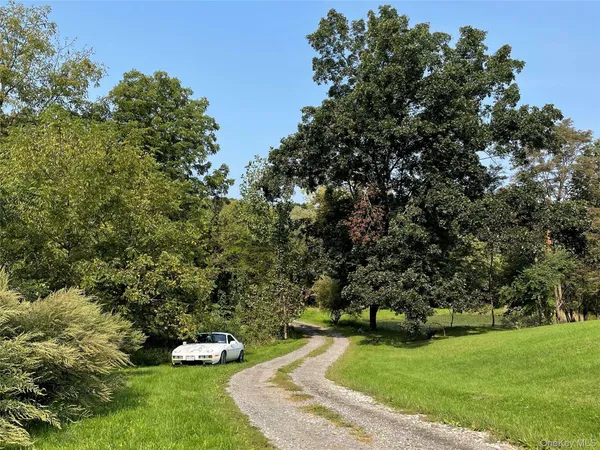 a view of a backyard with swimming pool
