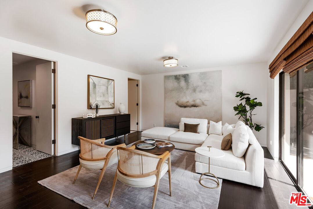 1018 Summit Drive Beverly Hills, CA 90210 - Photo 11 of 21 a living room with furniture