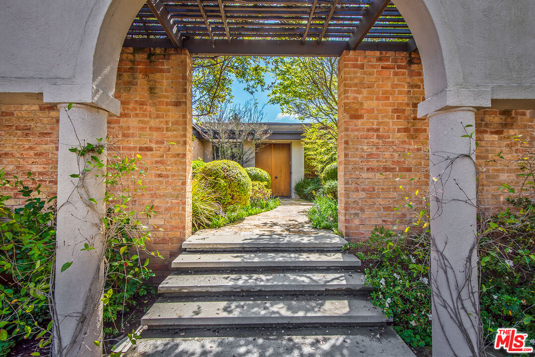 1018 Summit Drive Beverly Hills, CA 90210 - Photo 2 of 21 a view of a door of the house