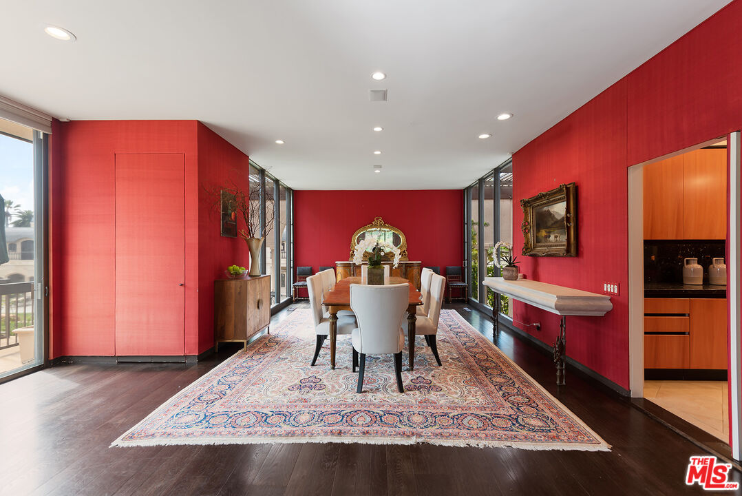 1018 Summit Drive Beverly Hills, CA 90210 - Photo 6 of 21 a living room with furniture and a flat screen tv