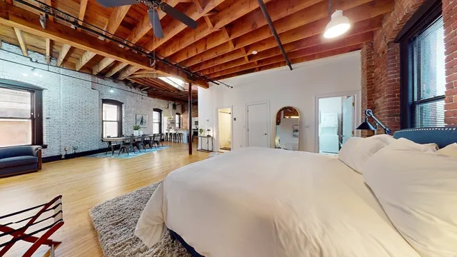 a bed room with a bed and a with swimming pool