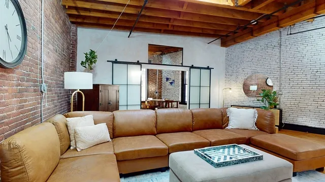 a view of a livingroom with furniture and a couch