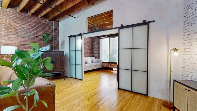 a view of entryway with wooden floor