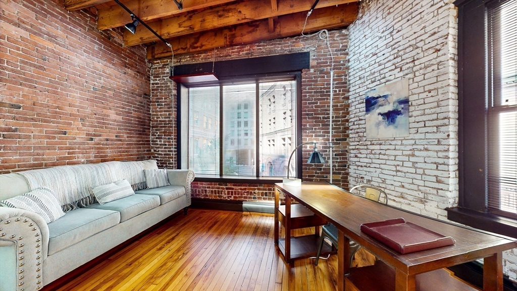 19 Stanhope Street, Unit 3A Boston, MA 02116 - Photo 7 of 19 a balcony with furniture and wooden floor