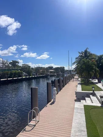 a view of a lake with a floor to ceiling window