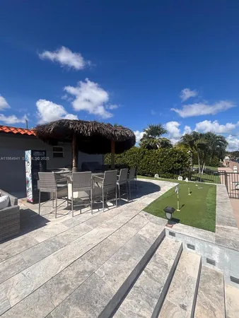 a view of a swimming pool with a patio