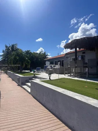 a bedroom with furniture and a lamp