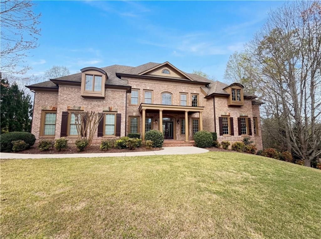 511 Affirmed Lane Alpharetta, GA 30004 - Photo 1 of 1 a front view of a house with a yard