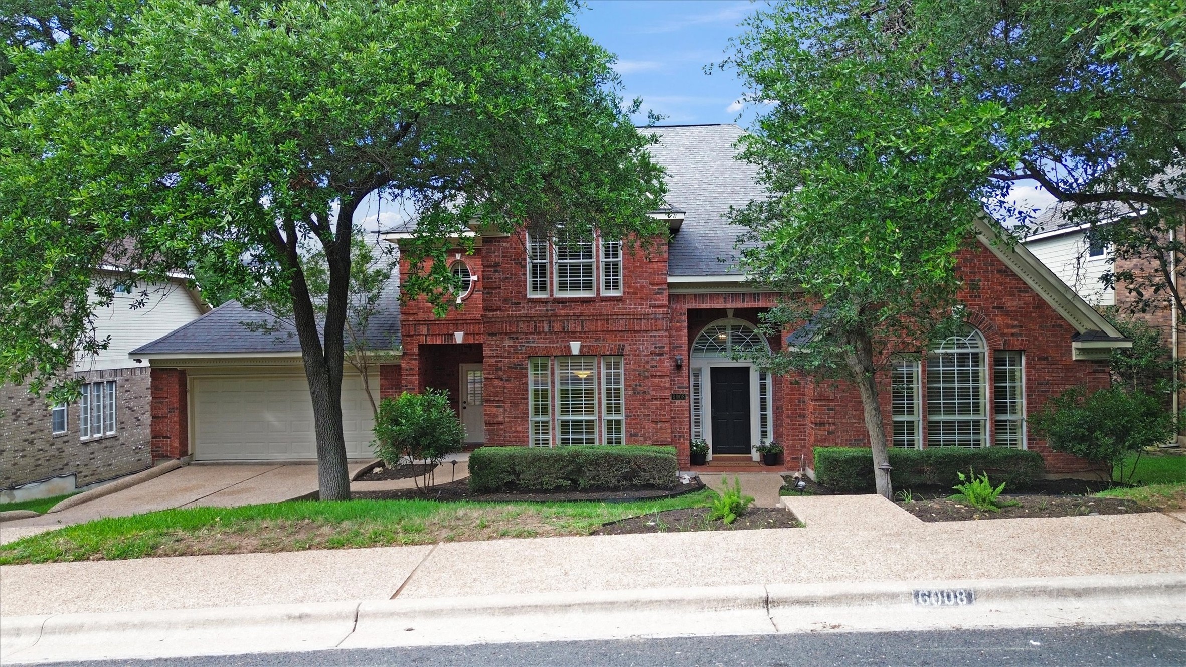 6008 Tributary Ridge Court Austin, TX 78759 - Photo 34 of 36 Arched entries and mature trees creates inviting curb appeal.