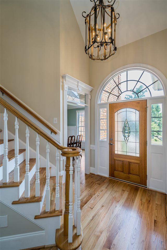 Two story foyer. Gleaming hardwood (newly refinished) floors run throughout the main level. Foyer