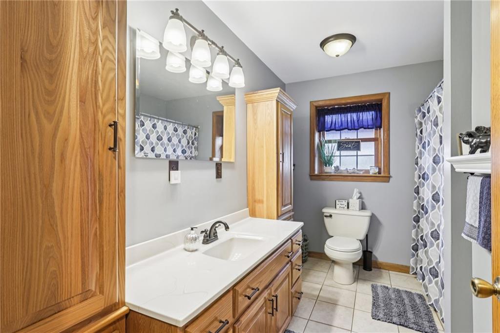 718 McDowell Road Volant, PA 16156 - Photo 15 of 34 a bathroom with a sink toilet and a mirror