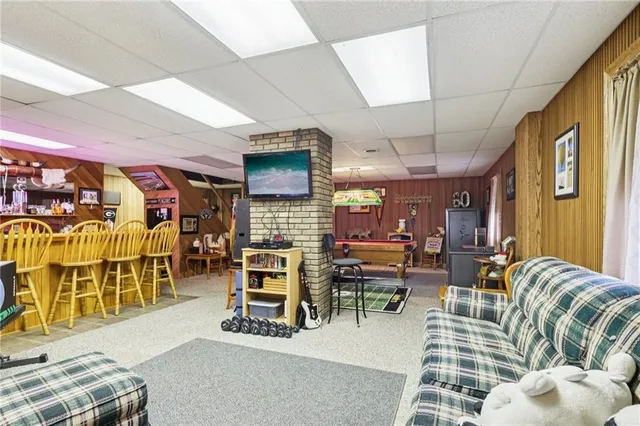 a view of a swimming pool with a chair and tables