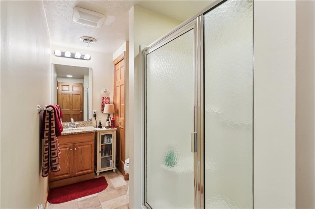 718 McDowell Road Volant, PA 16156 - Photo 21 of 34 a bathroom with a mirror sink and vanity