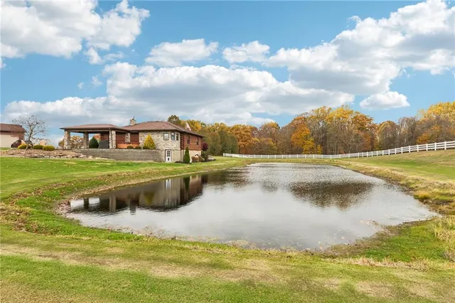 a view of a swimming pool with a table and chairs