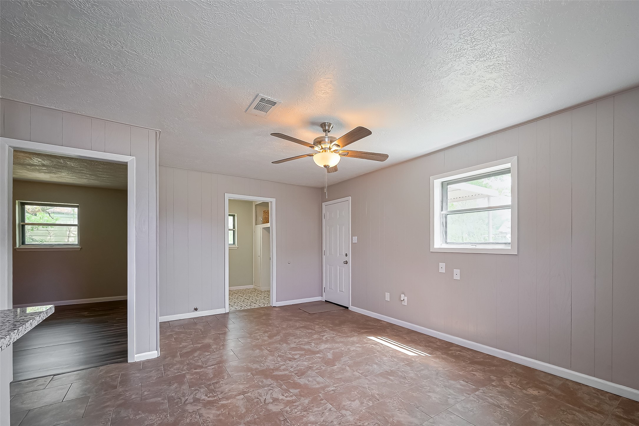 111 North 11th Street Highlands, TX 77562 - Photo 16 of 35 an empty room with closet and a ceiling fan