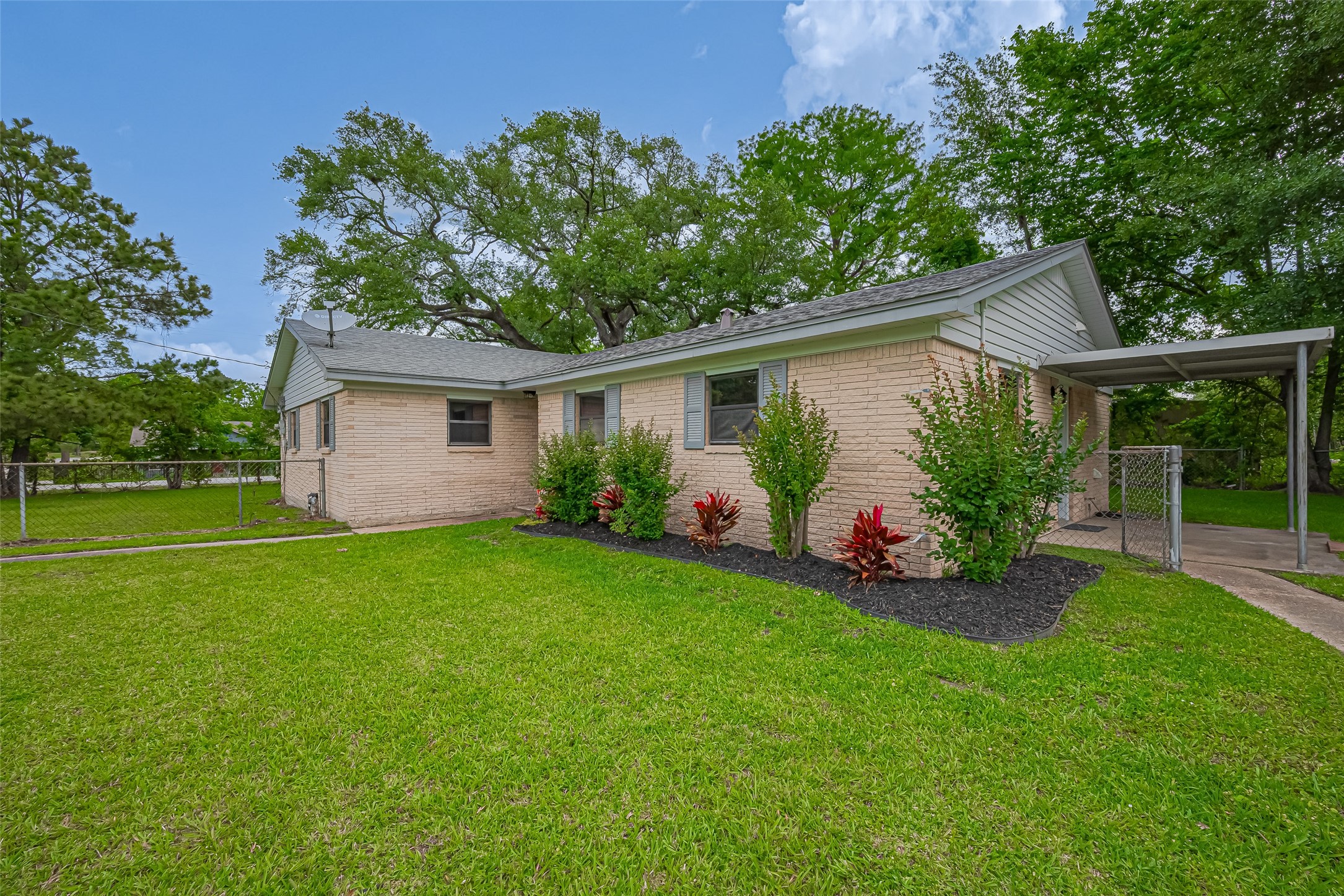 111 North 11th Street Highlands, TX 77562 - Photo 3 of 35 a view of a house with backyard and garden