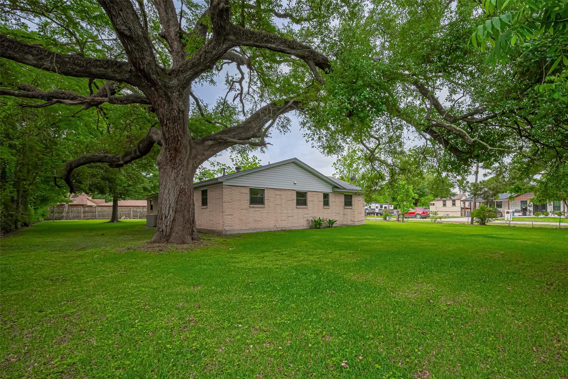 111 North 11th Street Highlands, TX 77562 - Photo 33 of 35 a view of a tree in front of a house with a tree