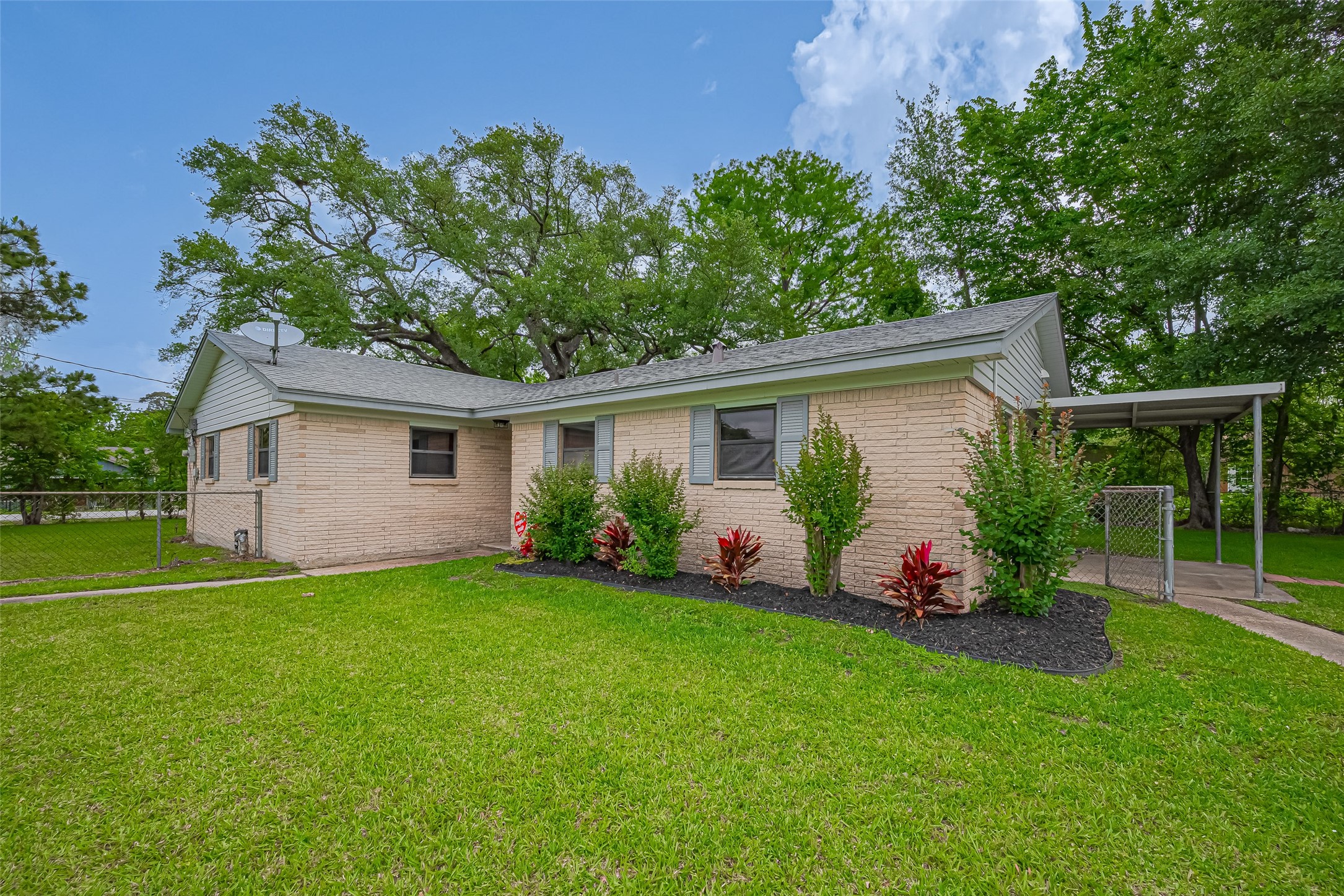111 North 11th Street Highlands, TX 77562 - Photo 35 of 35 a view of a house with backyard and garden