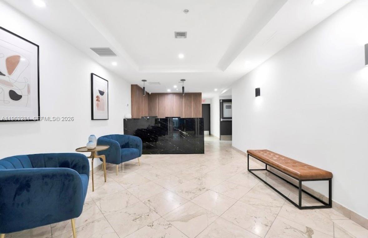 170 Southeast 14th Street, Unit 1606 Miami, FL 33131 - Photo 2 of 24 a living room with furniture and kitchen view