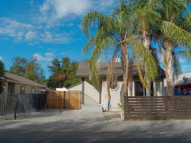 a view of a palm trees in front of house