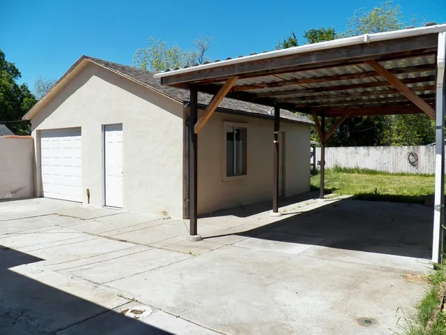 a view of a wooden house with a large window