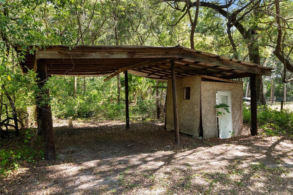 4329 Northwest 155th Street Reddick, FL 32686 - Photo 51 of 52 a view of a house with backyard and sitting area