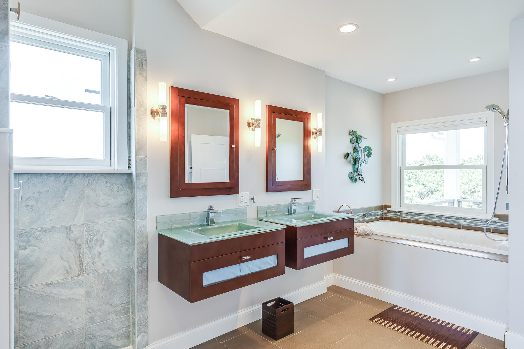 114 4th Street Wellfleet, MA 02667 - Photo 12 of 16 a spacious bathroom with sinks mirror and a bathtub