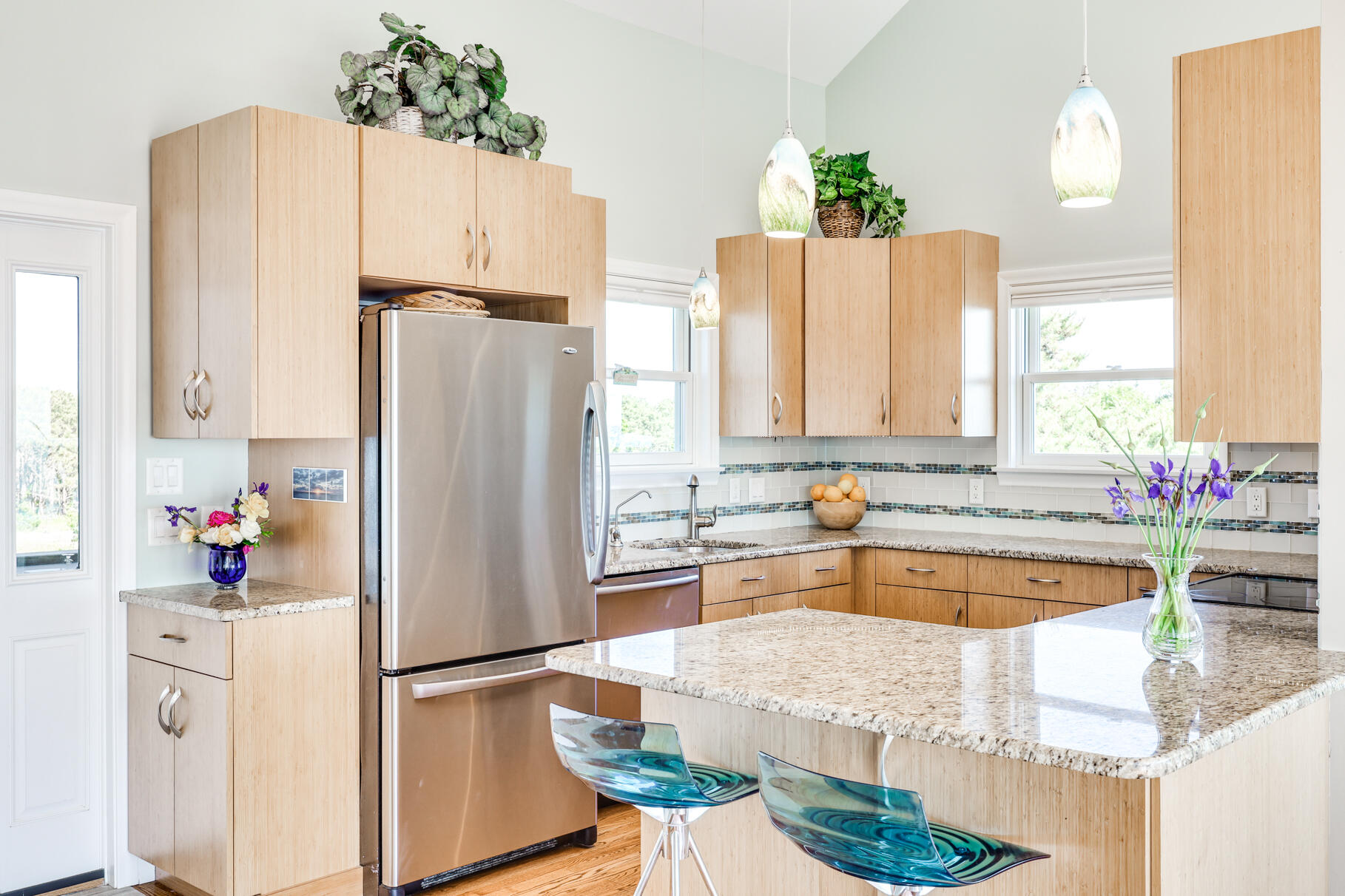 114 4th Street Wellfleet, MA 02667 - Photo 8 of 16 a kitchen with refrigerator and cabinets