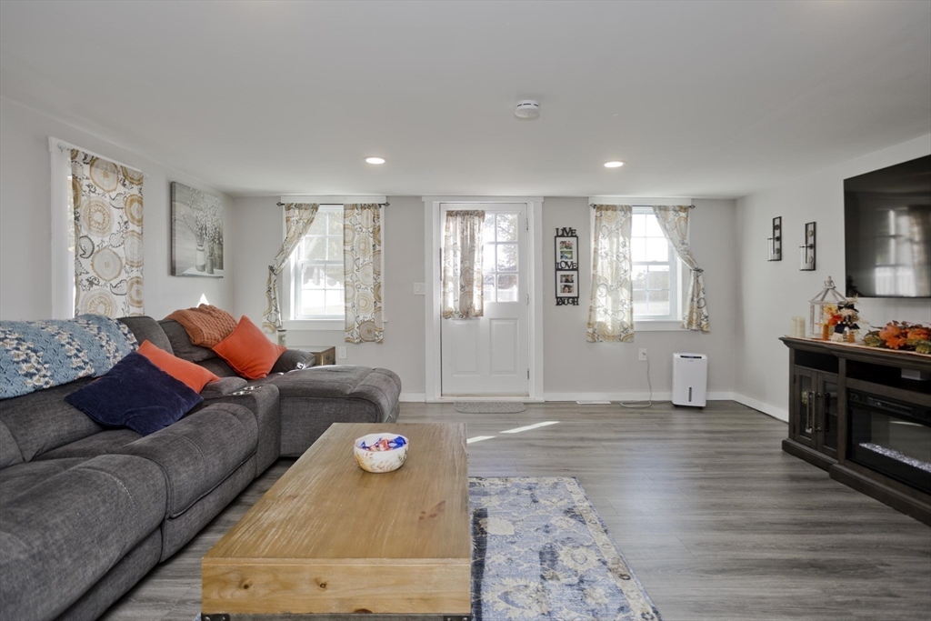 87 Pequot Point Road Westfield, MA 01085 - Photo 11 of 42 a living room with furniture and a flat screen tv