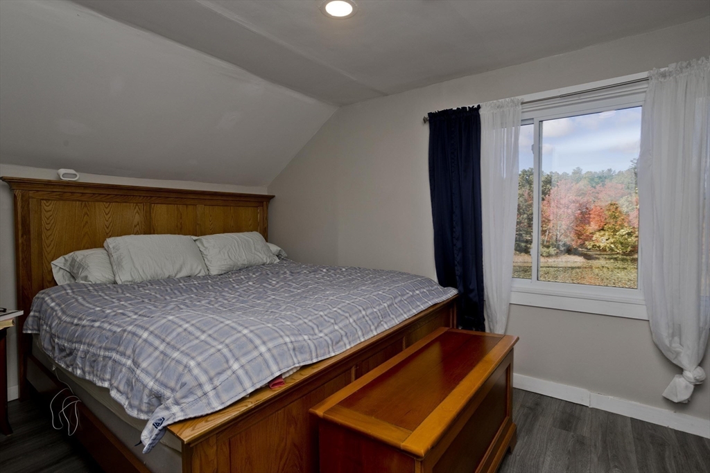 87 Pequot Point Road Westfield, MA 01085 - Photo 35 of 42 a bed sitting in a bedroom next to a window