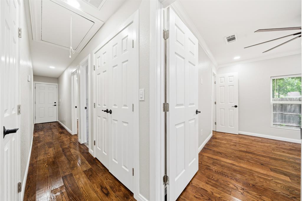 3313 South 3rd Street Waco, TX 76706 - Photo 8 of 28 a view of a hallway with white walls and wooden floors