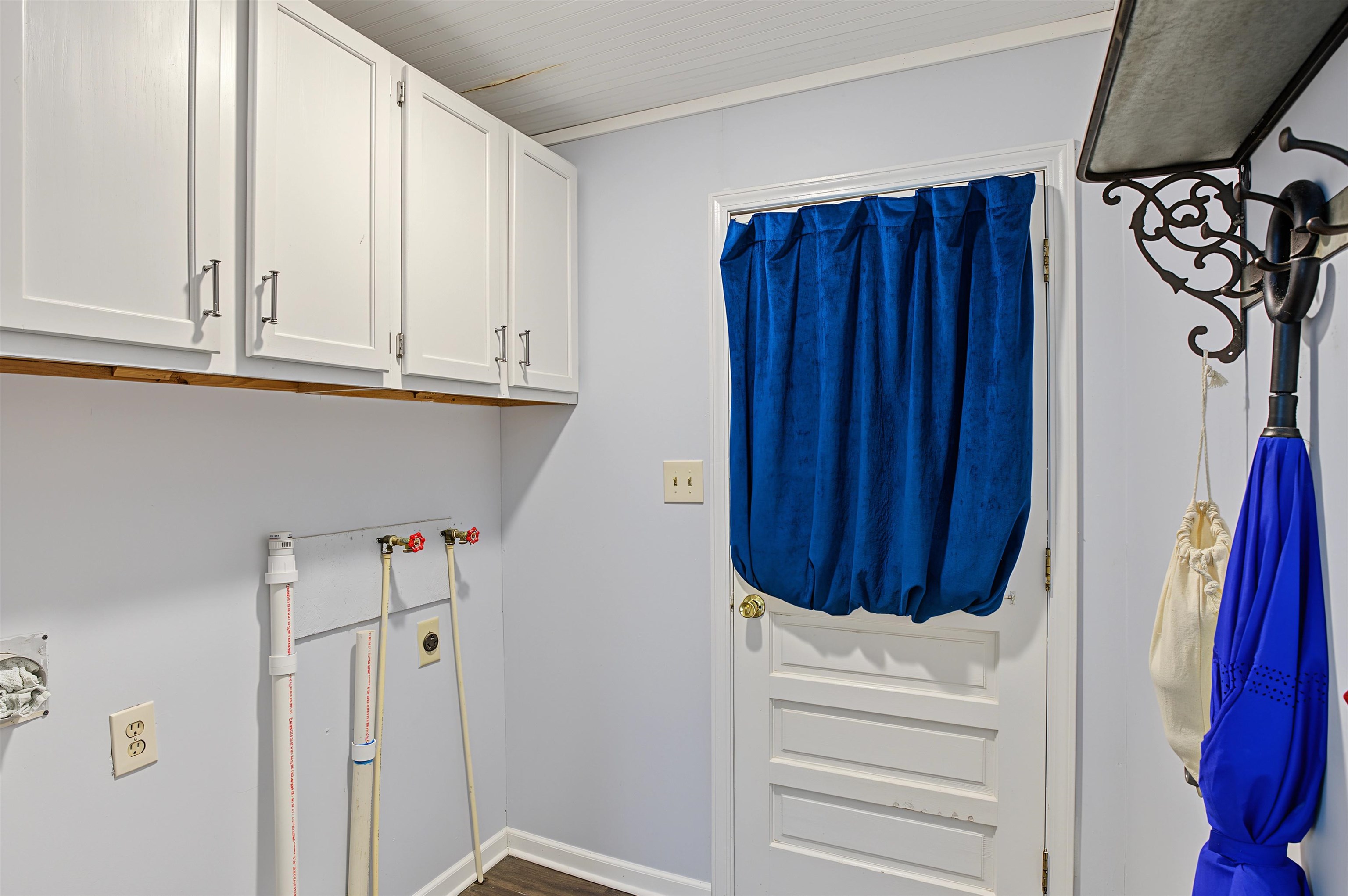 246 Cherryville Road Bells, TN 38006 - Photo 13 of 31 White shaker-style upper cabinetry with dark hardware