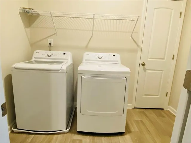 a utility room with dryer and washer